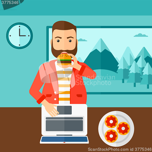 Image of Man eating hamburger. 