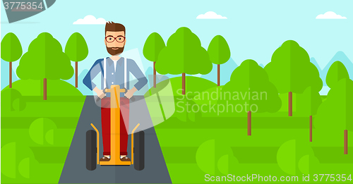 Image of Man riding on electric scooter.