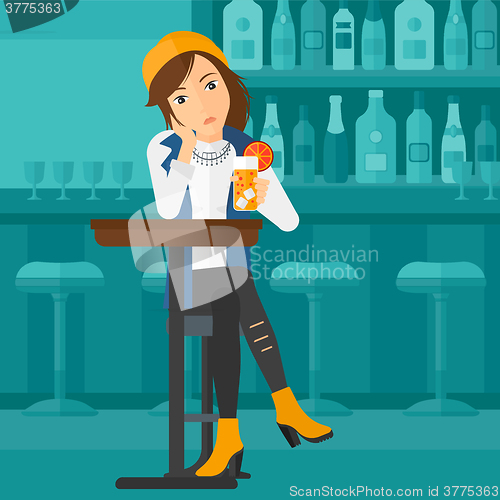 Image of Woman sitting at bar.