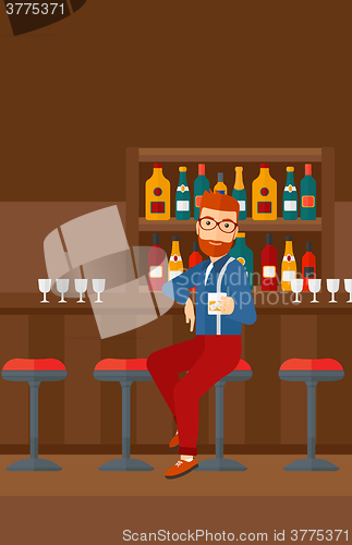 Image of Man sitting at bar.