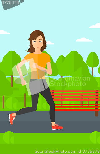 Image of Sportive woman jogging.