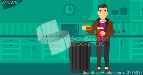 Image of Man throwing junk food.