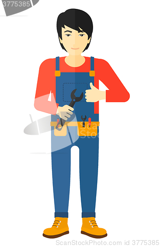 Image of Cheerful repairman with spanner.