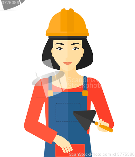 Image of Bricklayer with spatula and brick.