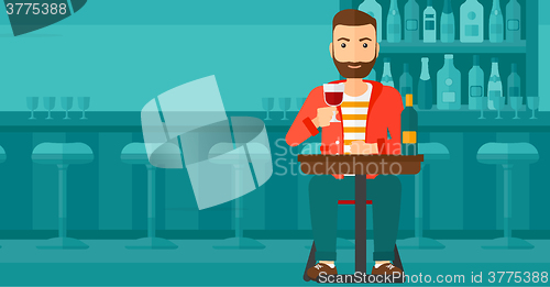 Image of Man sitting at bar.