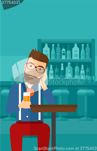 Image of Man sitting at bar.