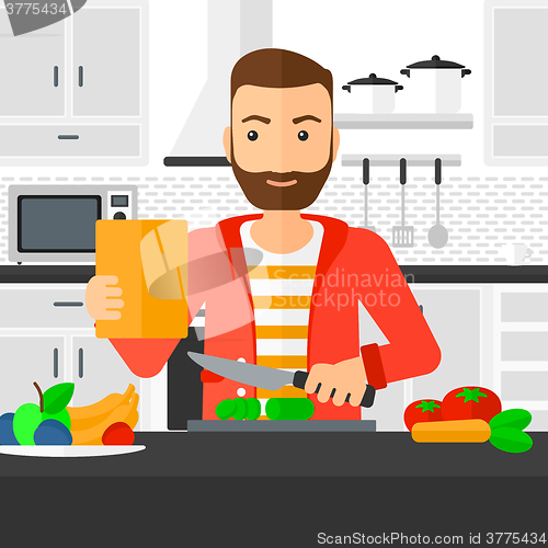 Image of Man cooking meal.