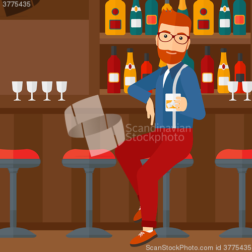 Image of Man sitting at bar.