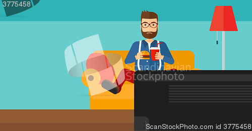Image of Man eating hamburger. 