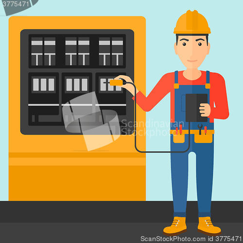 Image of Electrician with electrical equipment.