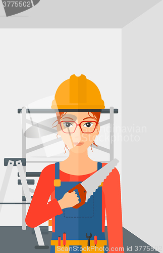 Image of Smiling worker with saw.