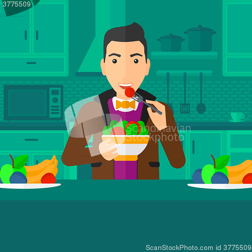 Image of Man eating salad.