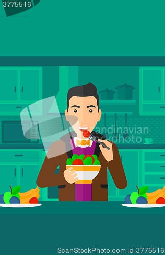 Image of Man eating salad.