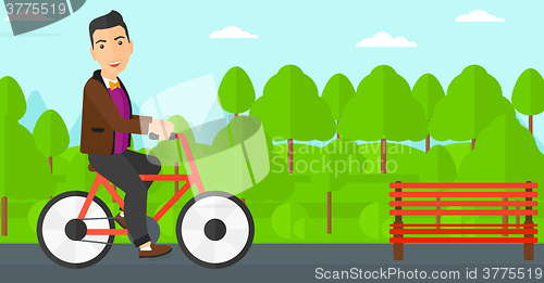 Image of Man riding bicycle.