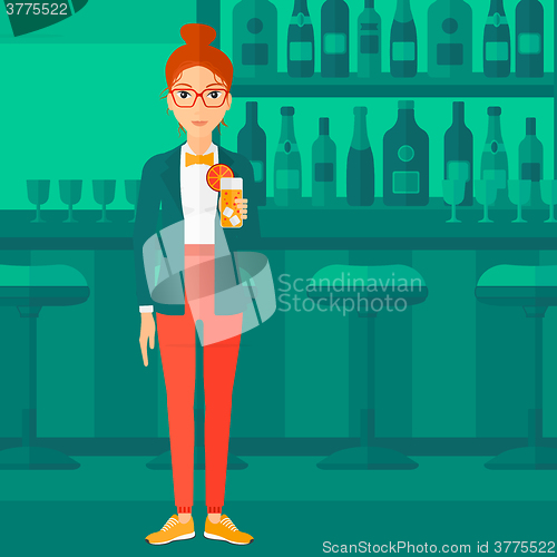Image of Woman holding glass of juice.