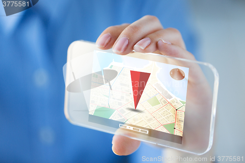 Image of close up of hand with gps on smartphone