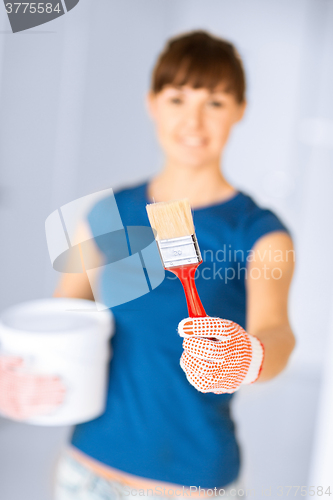 Image of woman with paintbrush and paint pot