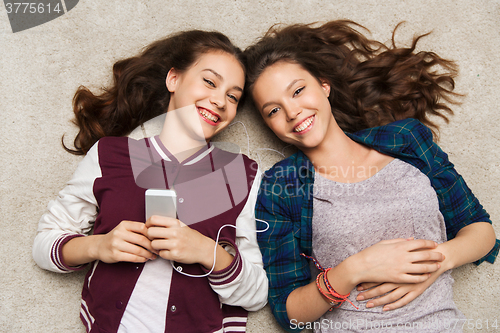 Image of teenage girls listening to music on smartphone