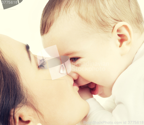 Image of mother kissing her baby