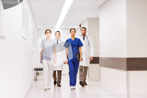 Image of group of medics or doctors at hospital corridor