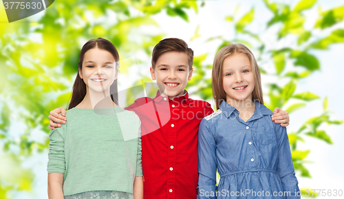 Image of happy boy and girls hugging