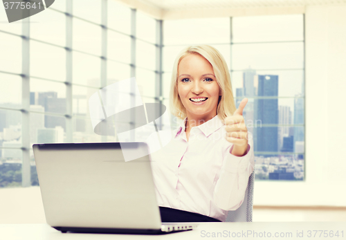 Image of smiling businesswoman or student with laptop