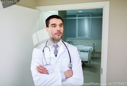Image of doctor with stethoscope at hospital corridor