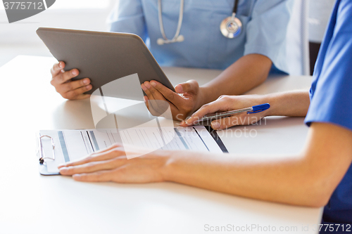 Image of close up of doctors with tablet pc at hospital