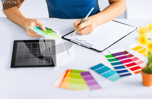 Image of woman working with color samples for selection