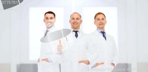 Image of group of doctors at hospital showing thumbs up