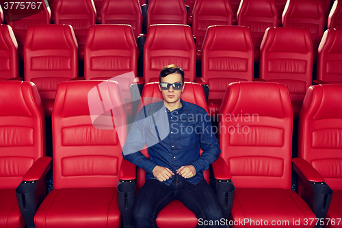 Image of young man watching movie in 3d theater