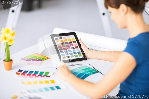 Image of woman working with color samples for selection