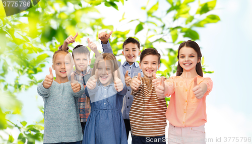 Image of happy children showing thumbs up