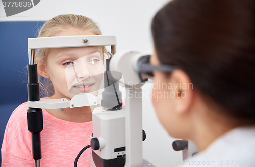 Image of optician with tonometer and patient at eye clinic