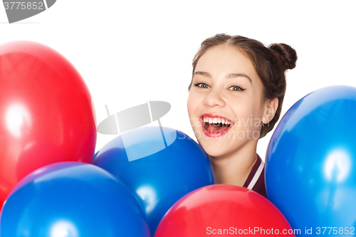 Image of happy teenage girl with helium balloons