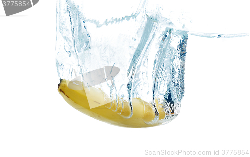 Image of banana falling or dipping in water with splash