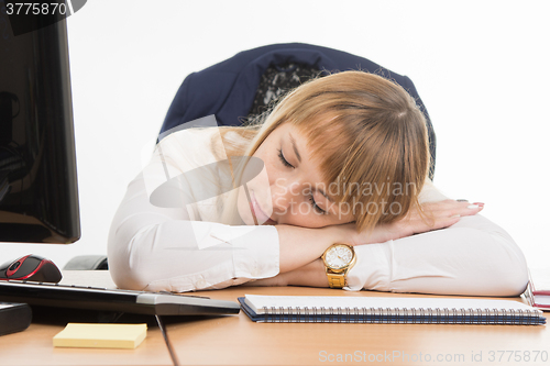 Image of Secretary sweetly asleep in the workplace