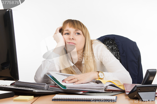 Image of Office tired a specialist to work with documents and wants to go home