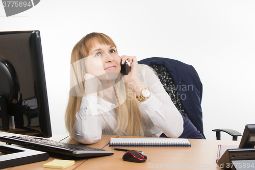 Image of Happy business woman talking on a cell phone for non-business issues