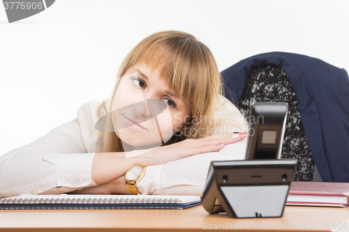 Image of Dormant office employee woke phone rang