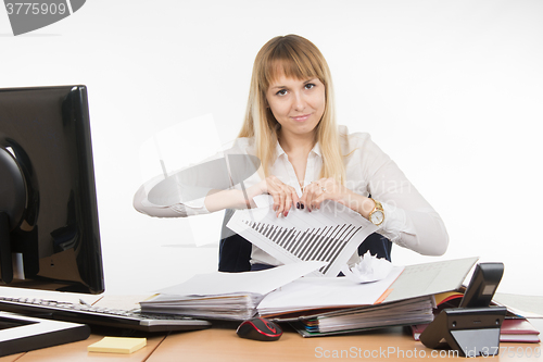 Image of Business woman tearing paper with the schedule