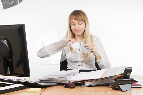 Image of Business woman tearing paper document