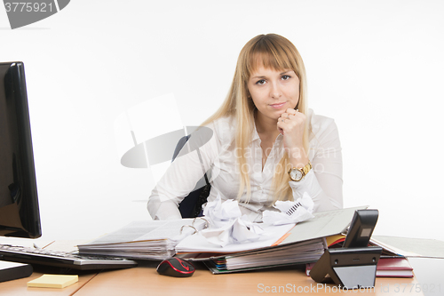 Image of Office Specialist nervously squeezed a few papers and evil looks in the frame