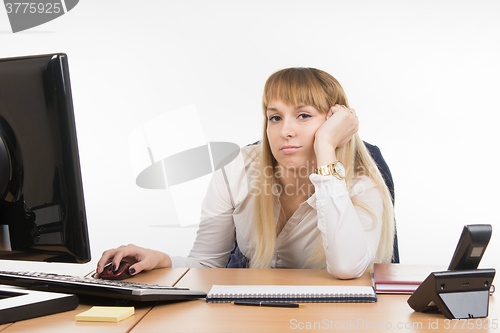 Image of Tired secretary in the workplace