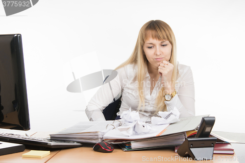 Image of Office Specialist from nerves and fatigue crushed some important documents