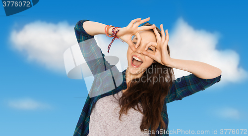 Image of happy teenage girl making face and having fun