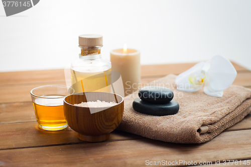 Image of close up of salt, massage oil and bath stuff