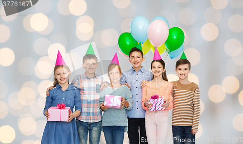 Image of happy children with gifts on birthday party