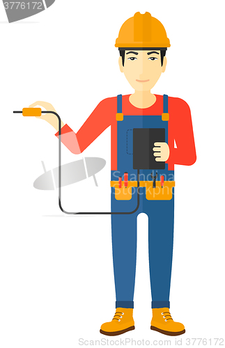 Image of Electrician with electrical equipment.