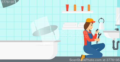 Image of Woman repairing sink.